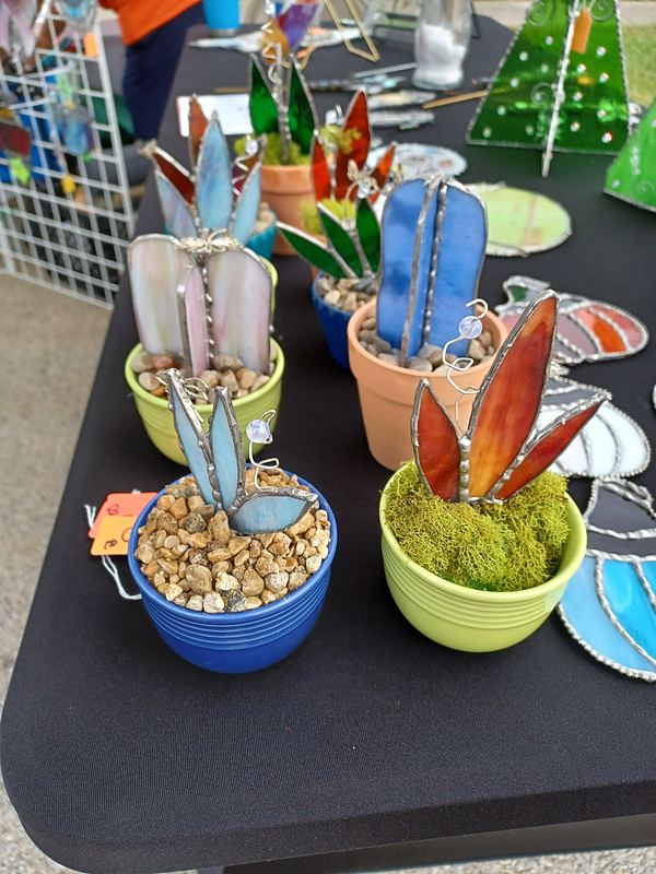 Stained-glass cactus and succulent picks in small pots by Kim’s Creative Cuts